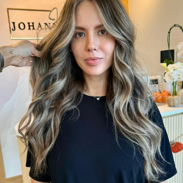 Long brunette hair with ash blonde balayage and waves